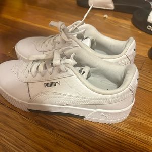 White and black women’s Pumas size 6